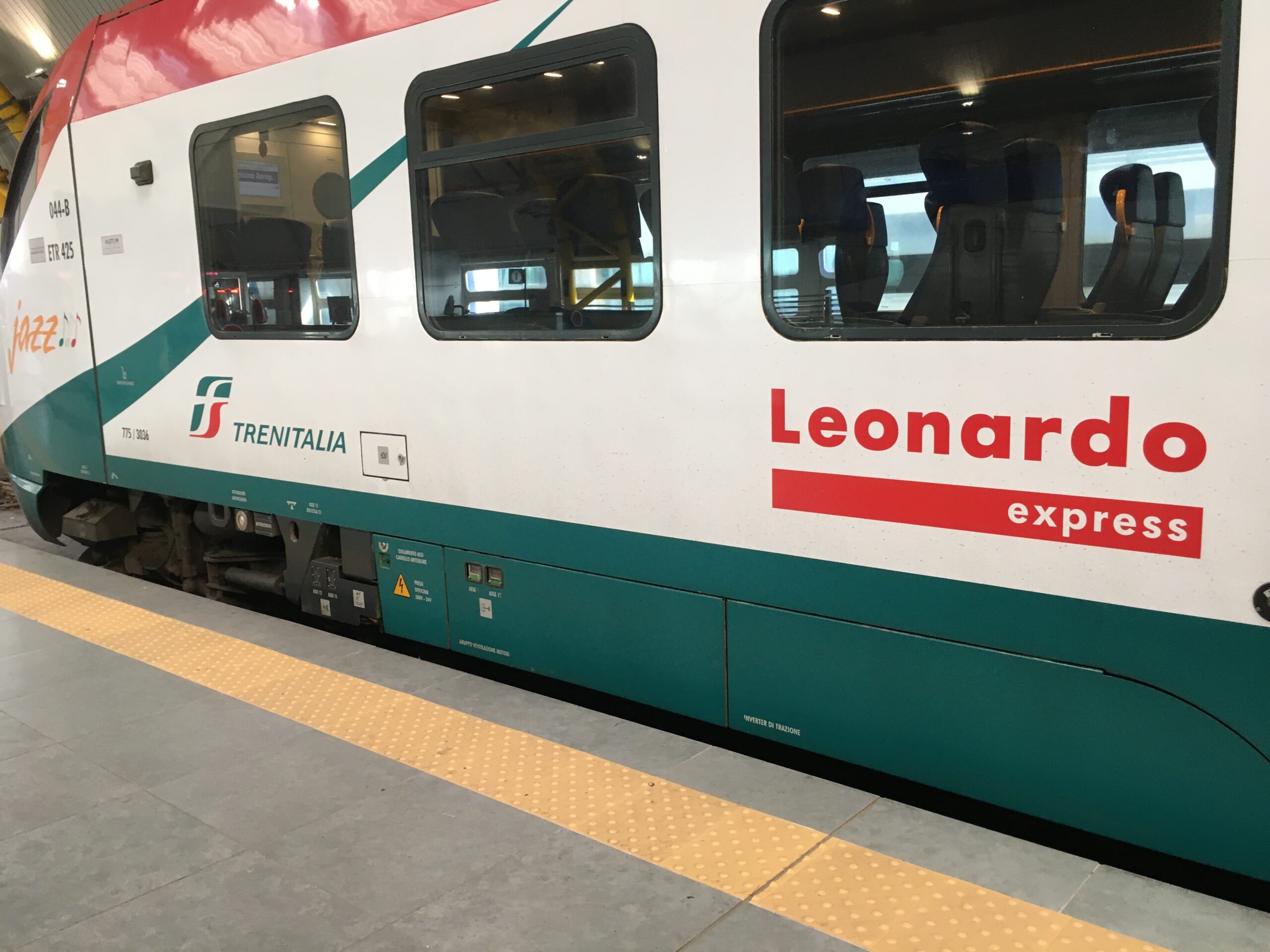Close view of Leonardo Express lettering on the side of a train.